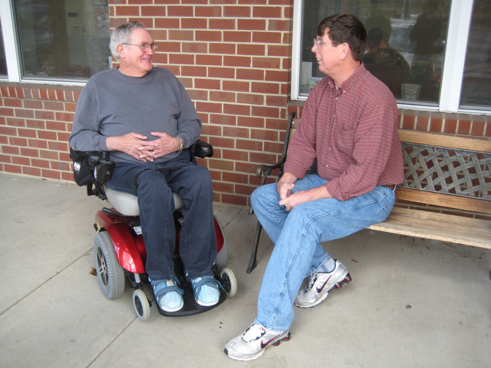 IRC director Tom Vandever and former Board of Directors member and advocate Harry Bowen chat in front of the IRC office